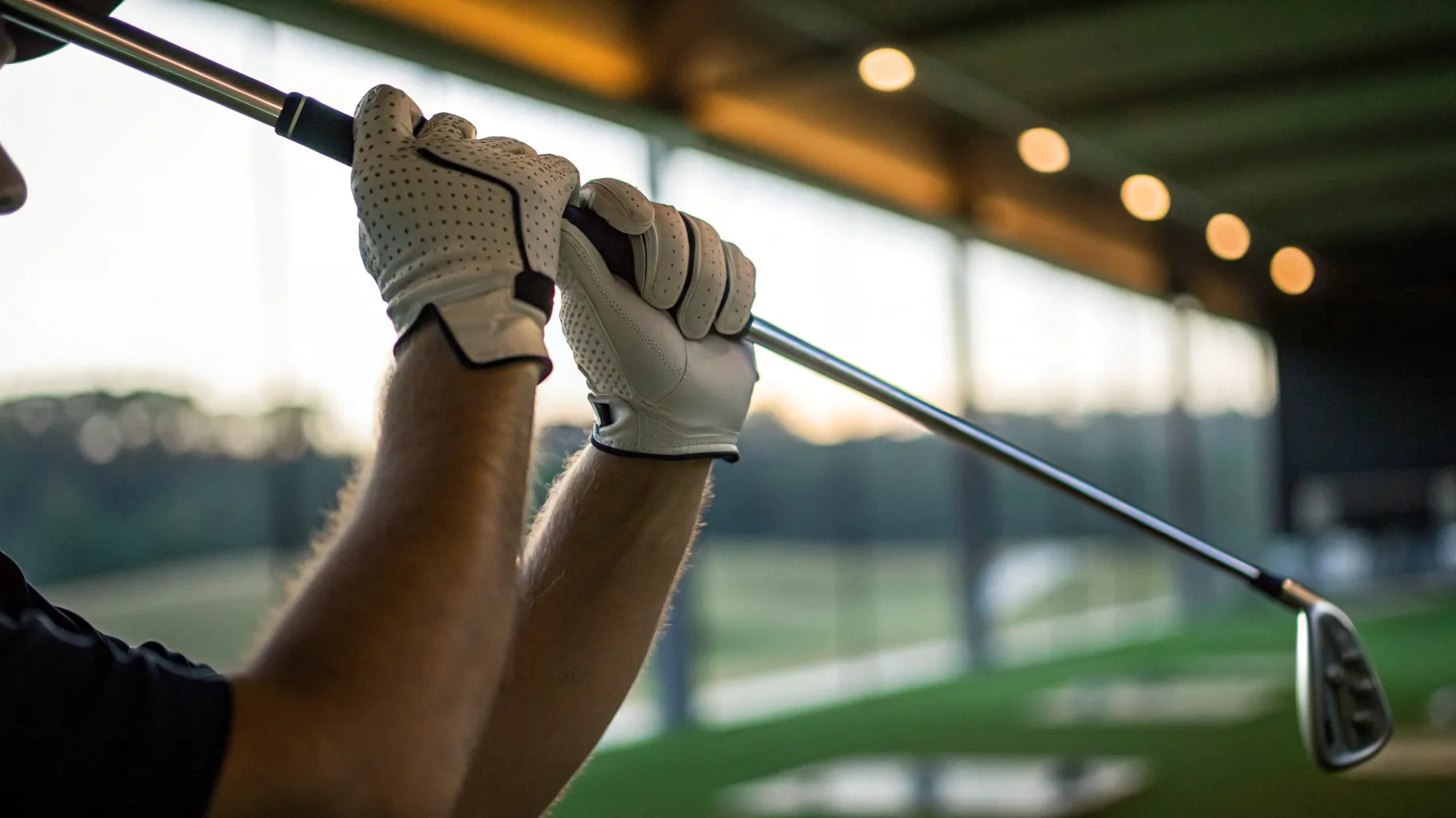 Golfer using a golf swing plane tool to improve consistency.