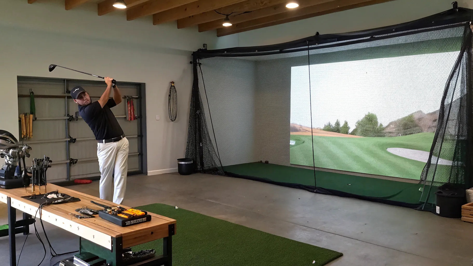 Golfer takes a swing in a home golf simulator built on a budget.
