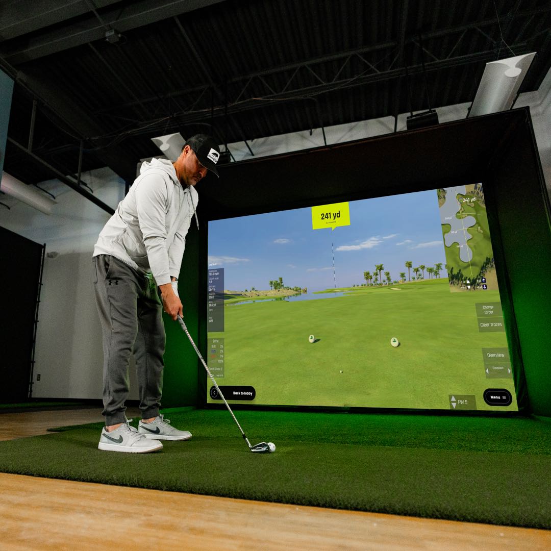 RSG Club Unlimited Pro Studio golf simulator setup with projector and full enclosure